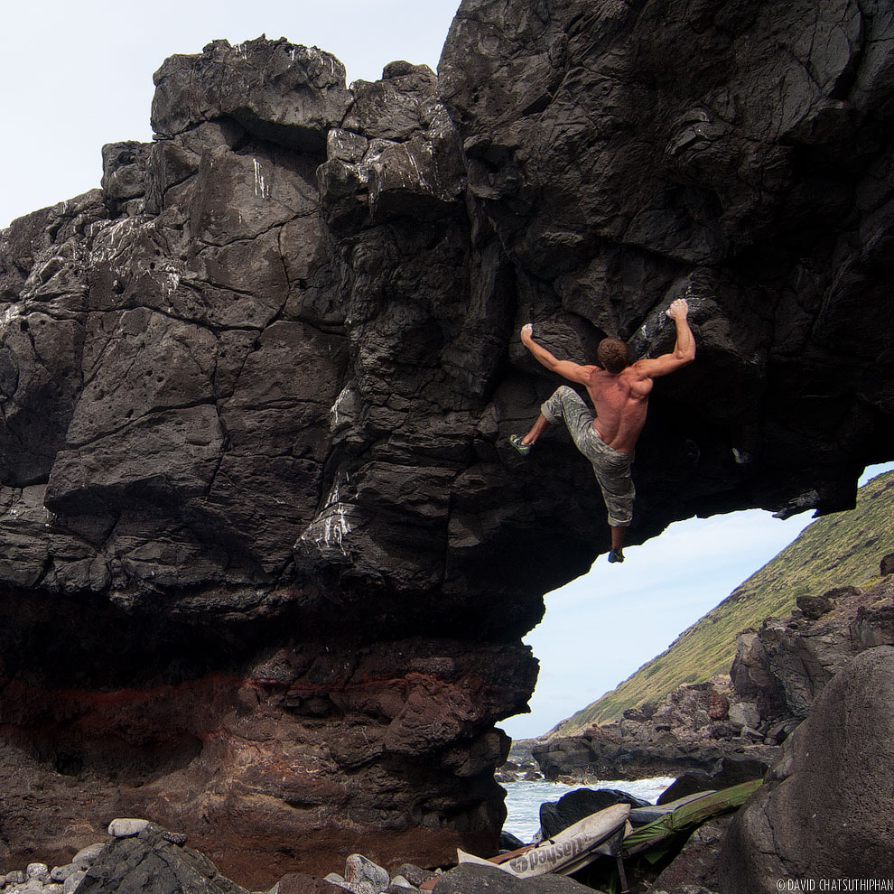 Justin Ridgely bouldering the Arch in Hawaii.