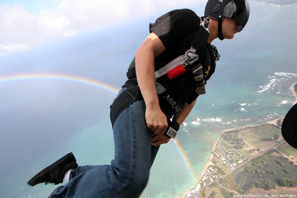 TK Hinshaw jumps into a rainbow while skydiving in Hawaii