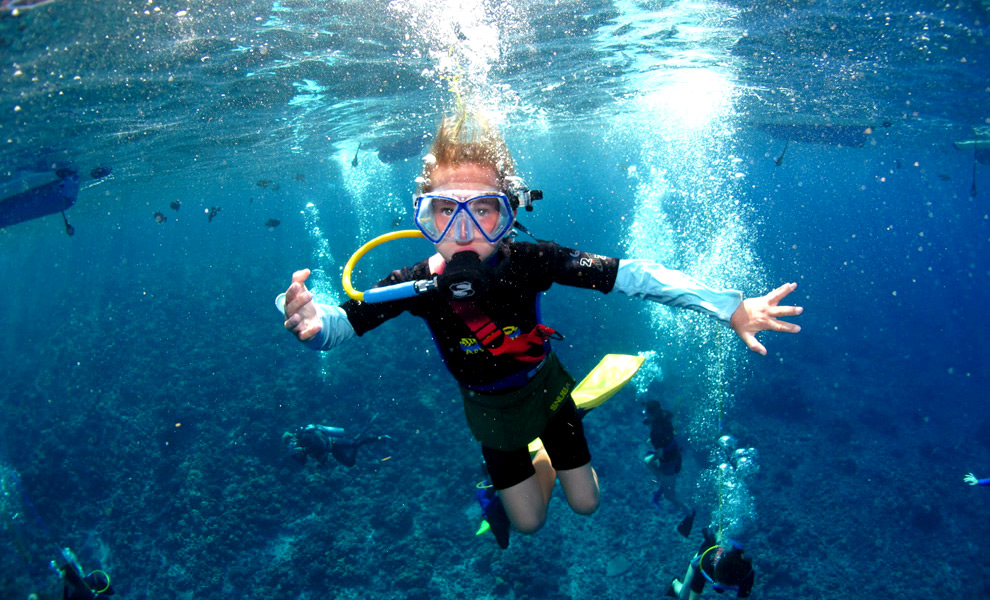 Snorkeling and snuba diving at Molokini Crater off the coast of Maui.