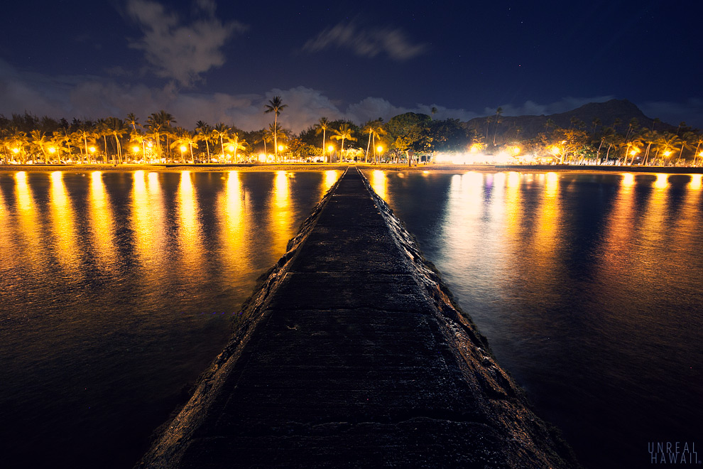 Jetty at night with Diamond Head in the background in Hawaii