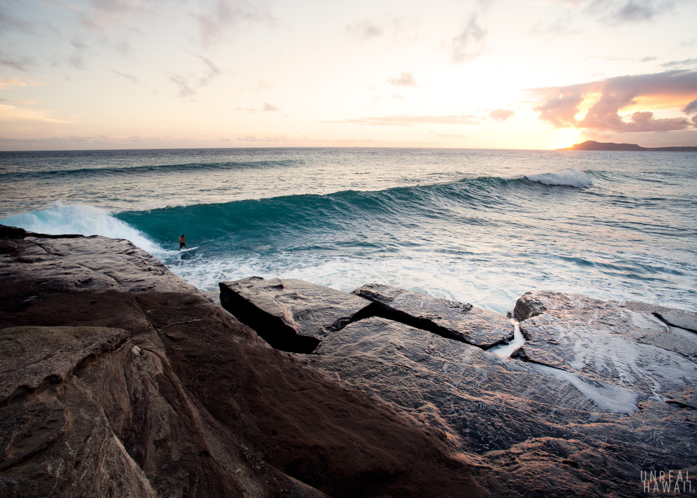 A surfer on a wave at China Walls, Oahu, Hawaii