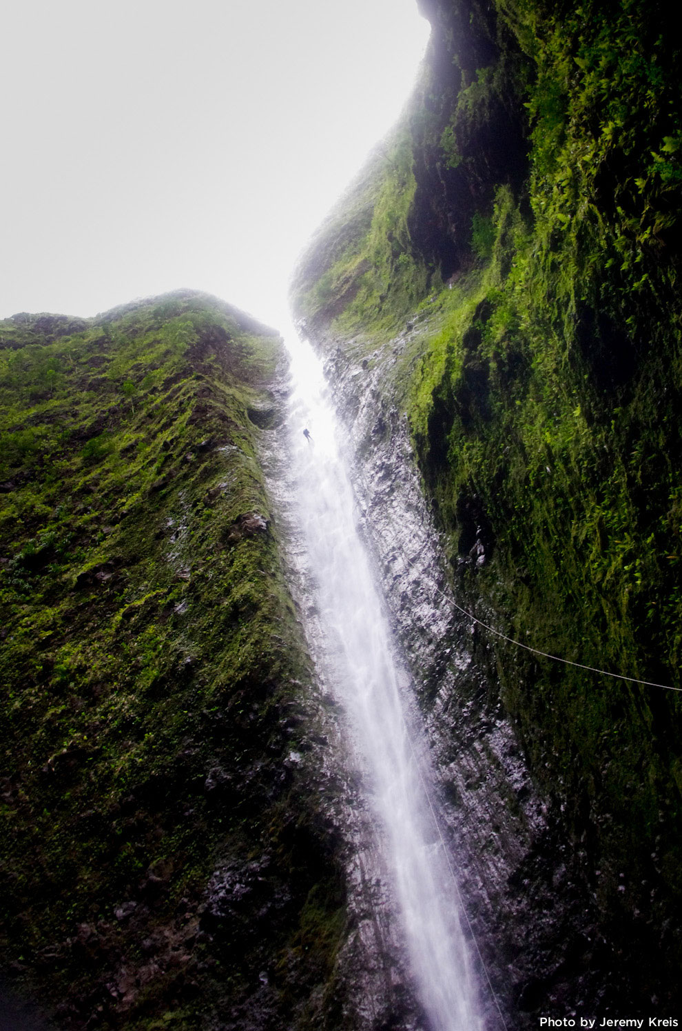 Kitt Turner rappelling a 500 foot waterfall on Oahu, Hawaii