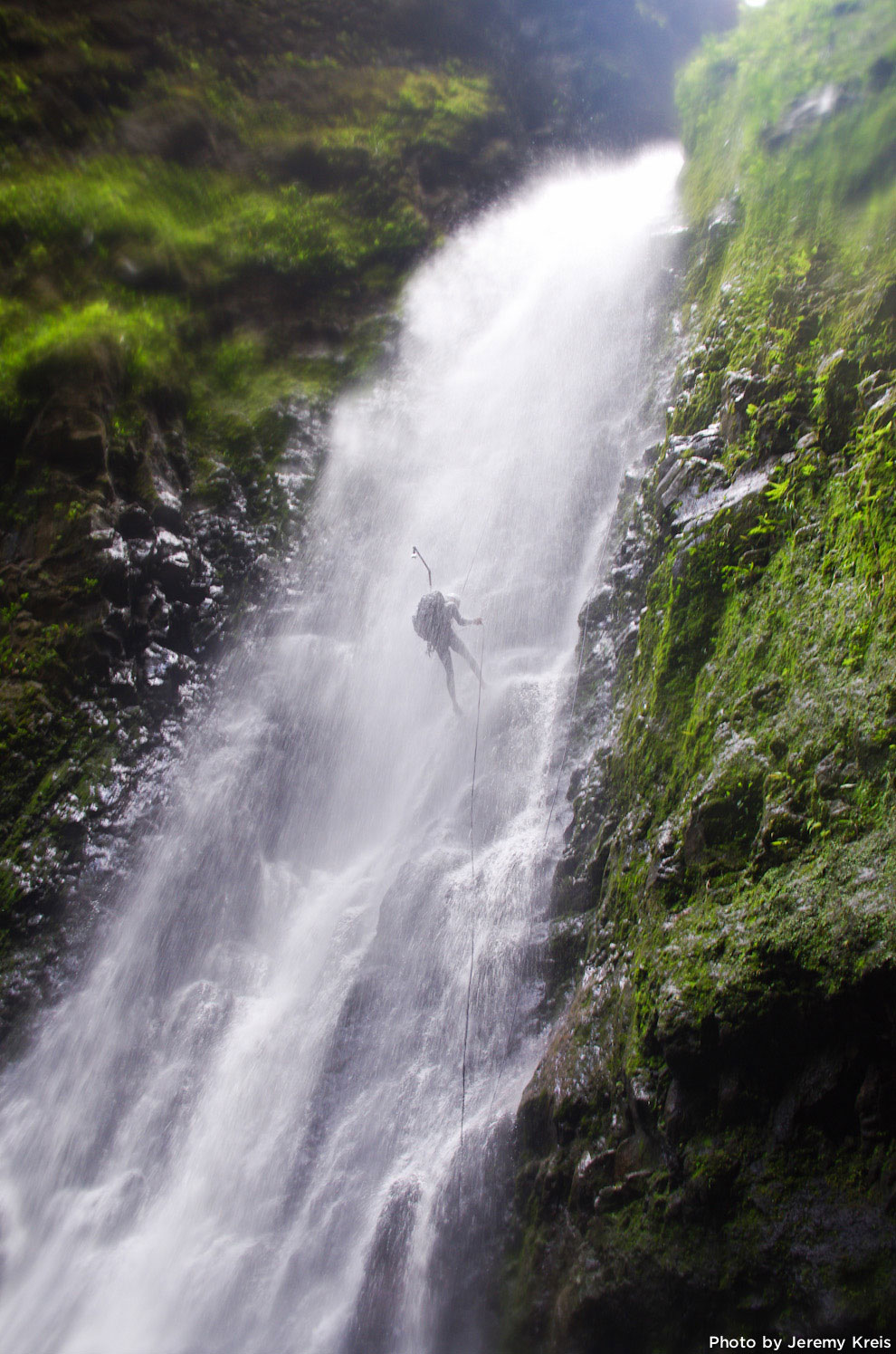 Kitt Turner rappelling down a waterfall on Oahu.