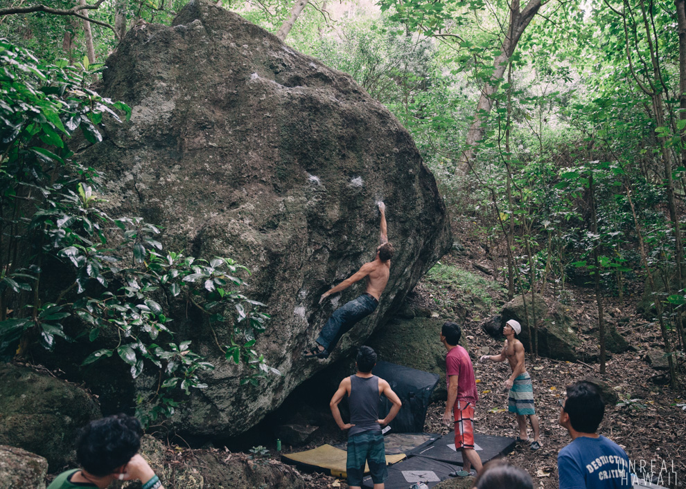 Justin Ridgely climbing a boulder at Triads on Oahu, Hawaii